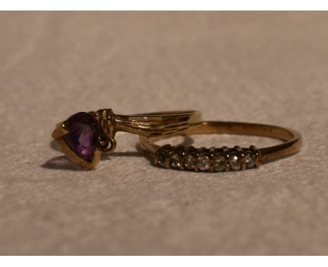 A lady's dress ring having seven CZ chips in a claw set mount on a 9ct gold loop, size P and a 9ct gold band with amethyst st