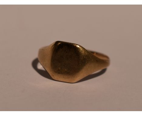 A 9ct gold signet ring of plain form, size M and 2.2g