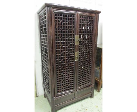 SCROLL CABINET, Ming style, Northern Chinese cedarwood with two doors of lattice design enclosing shelves and two small drawe