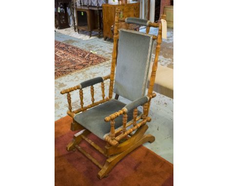 LATE 19TH CENTURY ROCKING CHAIR, with ring turned supports, blue fabric upholstery.
