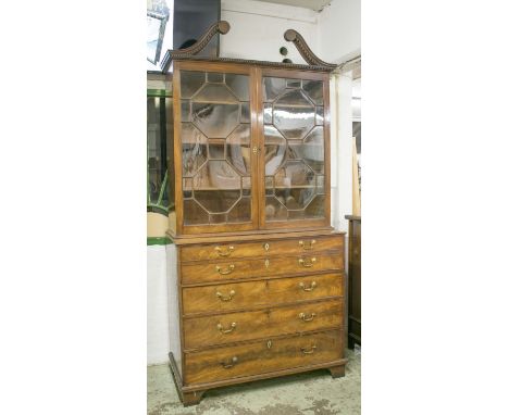 SECRETAIRE BOOKCASE, George III mahogany, circa 1780, the swan neck pediment over a pair of astragal glazed doors enclosing s