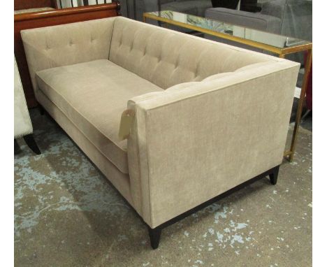 SOFA, two seater in beige buttoned upholstery on ebonised square supports, 190cm L.