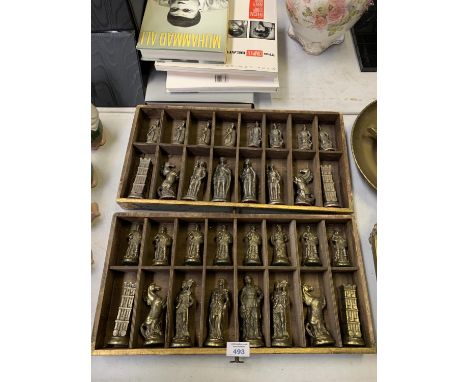 A COLLECTION OF METAL CHESS PIECES IN STORAGE BOXES 