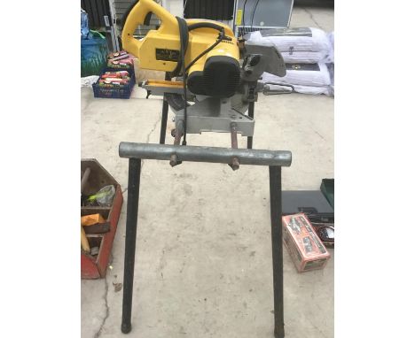 A DEWALT CHOP SAW ON A STAND IN WORKING ORDER 