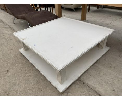 A MODERN WHITE SQUARE COFFEE TABLE WITH LOWER SHELF 