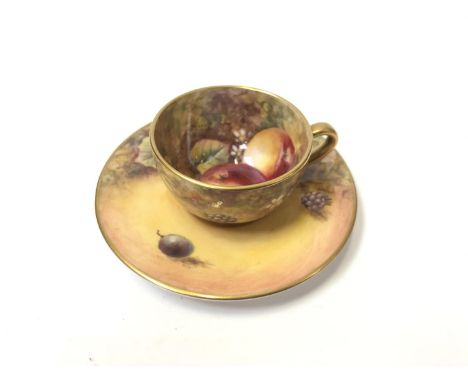 A ROYAL WORCESTER HAND PAINTED 'FRUIT STUDY' MINIATURE CUP AND SAUCER, BOTH SIGNED J.SKERRETT 