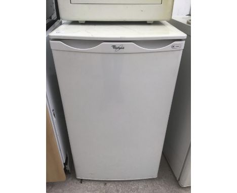 A WHIRLPOOL UNDER COUNTER FRIDGE IN WORKING ORDER (DOOR SHELF MISSING) 