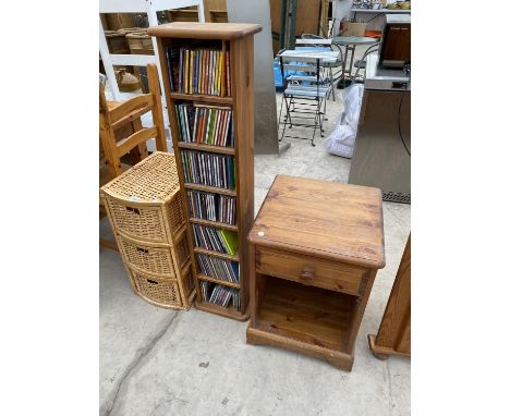 A WICKER CHEST OF THREE DRAWERS, A PINE CD RACK AND A PINE BEDSIDE CABINET 