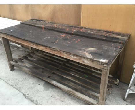 A VINTAGE PINE WORKBENCH/TABLE WITH LOWER SHELF 