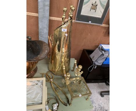 A VINTAGE BRASS COMPANION SET, TRIVET STAND AND FIRE DOGS 