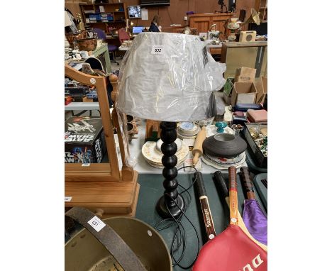 A MODERN BLACK LAMP BASE WITH SHADE 