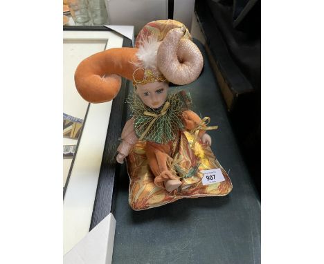 A CERAMIC MARDI-GRAS CLOWN MUSICAL WIND UP TOY 