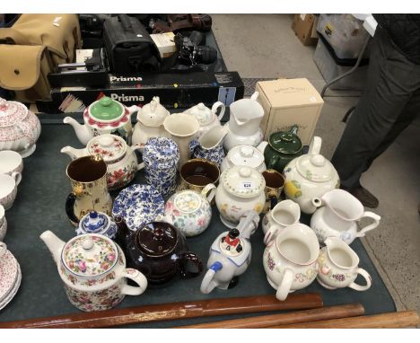 A LARGE GROUP OF CERAMIC NOVELTY TEAPOTS ETC 