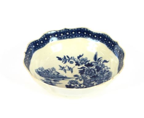 A Worcester shallow bowl, decorated with fence pattern, under-glazed blue crescent mark to base, 15cm dia.