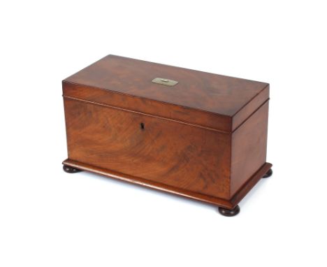 A 19th Century mahogany tea caddy, fitted canisters with sliding lids, central glass mixing bowl, raised on bun feet, 36cm wi