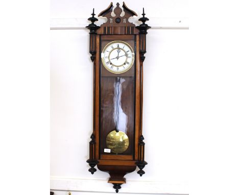 A Victorian walnut cased regulator type wall clock, having circular brass mounted Roman numeral dial, visual weights and pend