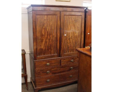A 19th Century mahogany linen press, converted to a hanging wardrobe, two short and two long drawers, raised on bracket feet,