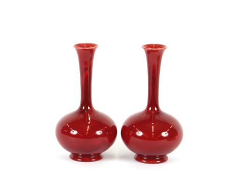 A pair of Burmantofts Sang de boef pottery vases,&nbsp;19.5cm high