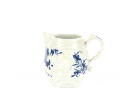A Worcester barrel shaped cream jug, with floral decoration and scroll handle, 7cm high