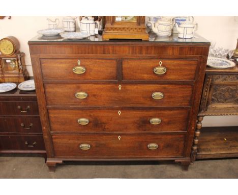 A George III mahogany and satin wood strung chest,&nbsp;fitted two short and three long drawers, raised on ogee bracket feet,