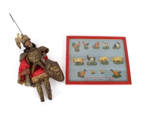 An antique puppet in the form of a knight in armour;&nbsp;together with a collage of 1930's coloured metal farm animals, fram