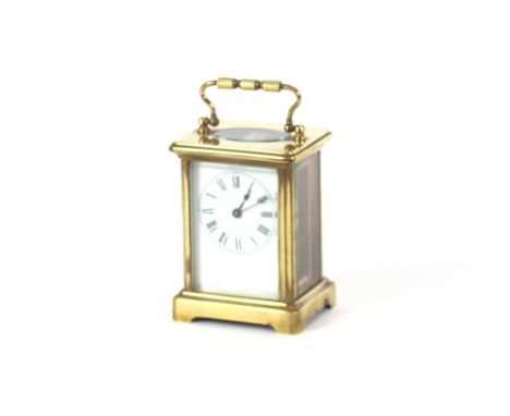 A French brass cased carriage clock, having Roman numeral dial, 12cm high