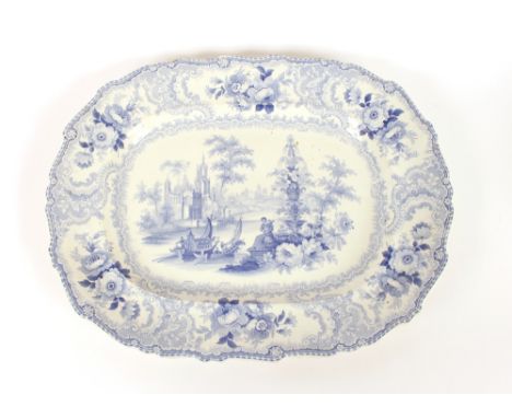 A large 19th Century blue and white transfer printed meat plate, decorated with parkland; two other meat plates; a large circ