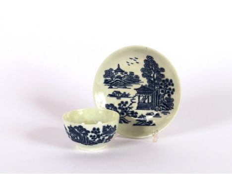 A Worcester tea bowl and saucer, decorated with pagodas and river scene, crescent mark to base