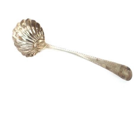 A George III silver sauce ladle, having fluted bowl, bearing family crest, London 1782