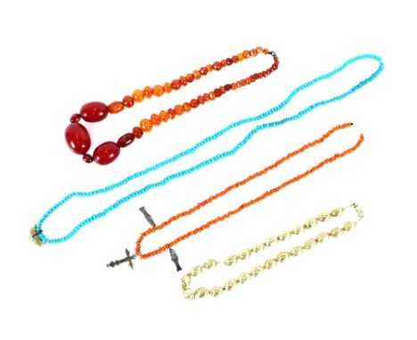 A silver gilt necklace;&nbsp;an amber necklace; an 18th Century coral and silver cross necklace; a turquoise sharks tooth nec