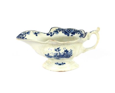 A 18th Century Worcester sauce boat, of triangular pattern, workman's mark to base, with raised moulded decoration and blue g