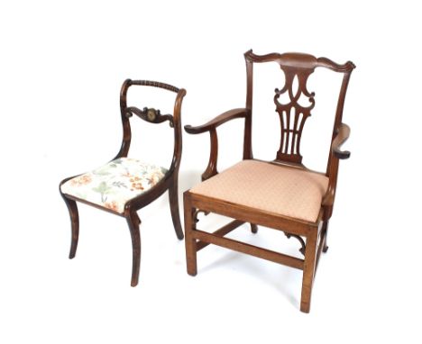 A Georgian mahogany elbow chair, in the Chippendale manner having out swept arms, upholstered drop in seat raised on square s