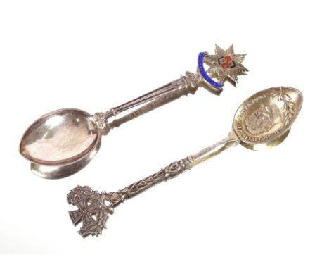 Two souvenir spoons, one commemorating Hindenburg dated 1914; and another with enamel decoration "The Kensingtons"