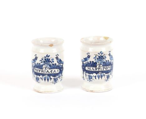 A pair of 18th Century Albarello E.MART:POM. and C:THYRiACA: with blue bird and basket decoration, 13cm high