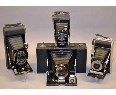 A cased Eastman Kodak No.3 folding brownie with Bausch and Lomb components, a Voigtlander jubilar folding camera, a Coronet C