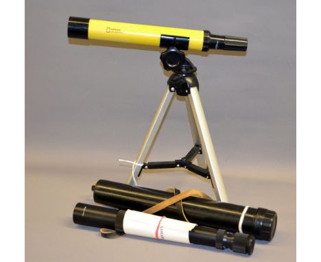 A vintage Soviet "Tourist" telescope, cased with instructions and a National Geographic telescope. 