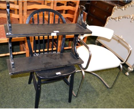 A retro stainless steel chair together with a black wall shelf and a chair