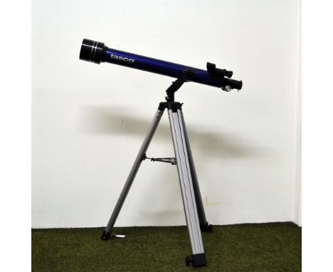 A Tasco Galaxee astronomical telescope on an aluminium tripod