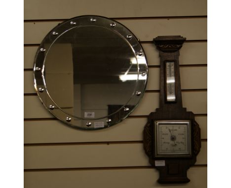 A barometer along with a circular Art Deco style wall mirror 
