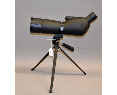 A Traveler 20/60x60 prismatic telescope cased with tripod.