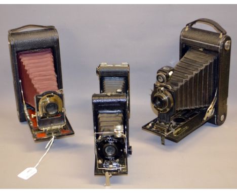 A boxed Ensign All-Distance pocket model 2; a cased Eastman Kodak; a cased Kodak Jr Autographic No 3-A and a cased Rex foldin