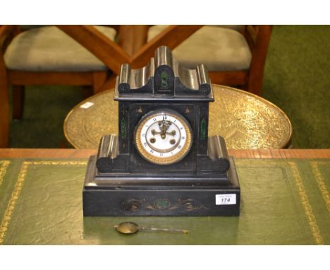 A Victorian slate mantel-clock with escapement