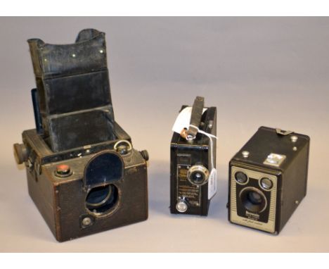 A cased Coronet 1934 Model B Cine camera; Kodak No 2 Brownie Box; Kodak Model D Brownie Box and an Ensign Focal-plane Reflex