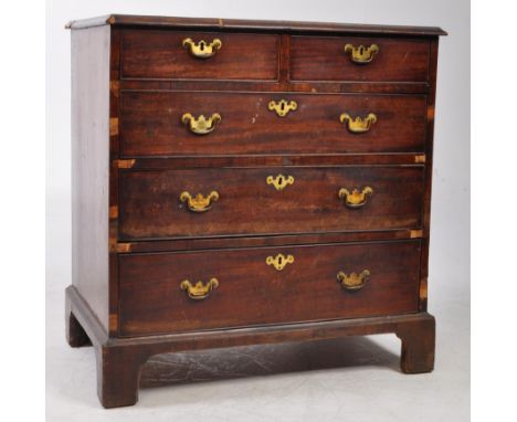 An early 19th century George III mahogany bachelors chest of drawers. The chest raised on bracket feet, with two short over t