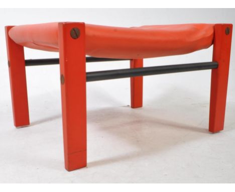 Arkana - A vintage 20th century Arkana Furniture footstool. The stool having red faux leather upholstered cushion to top, rai