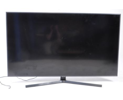Large Samsung 65" 4K smart UHD flatscreen television Model UE65RU7400U in black colourway. Measures approx: 93x146x38cm