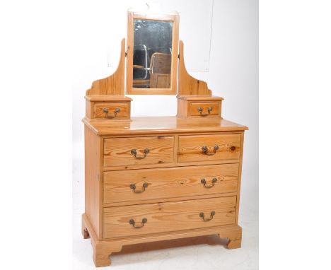 Victorian ash / oak wood dressing table chest of drawers. Swing mirror and trinket drawers over chest with short and deep dra