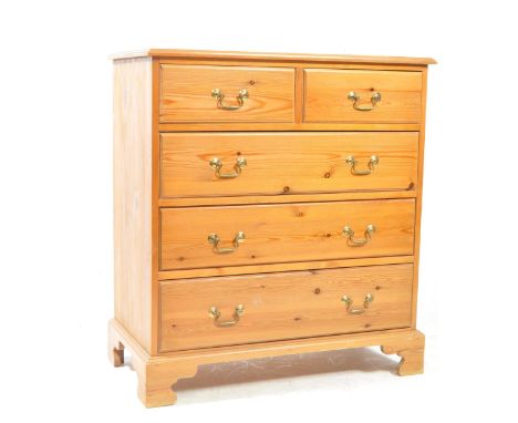 A pine 20th century chest of drawers. Chamfered edge rectangular form with two over three drawers. Raised on bracket feet wit