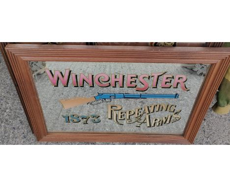 A reproduction Winchester Repeating Rifle advertising mirror, 37 x 55cm 