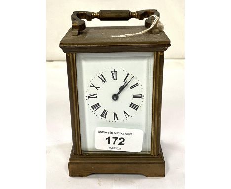 A late 19th/early 20th century brass carriage clock with timepiece movement by Dent, Pall Mall, London 